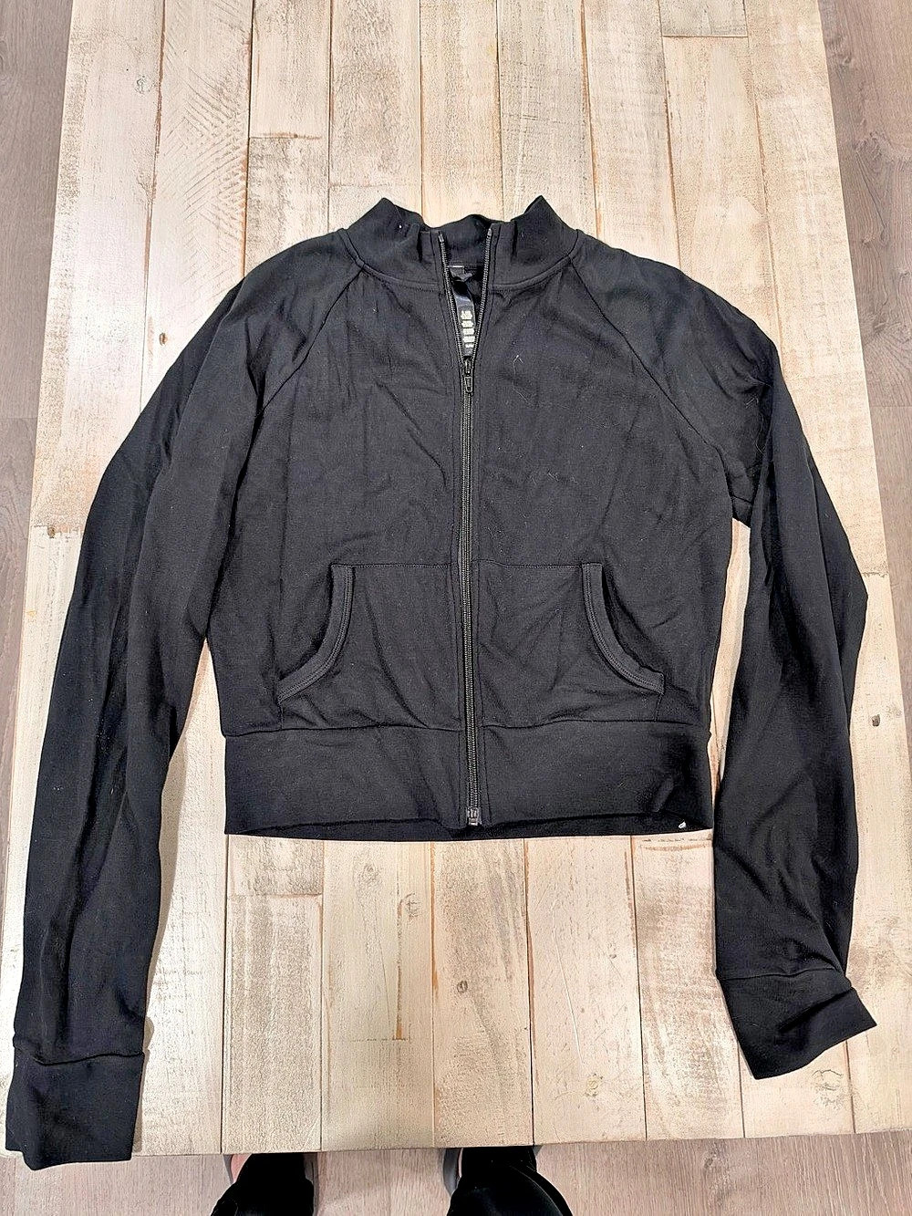 SKIMS Outdoor Track Jacket in solid black, size Medium. New without tags (NWOT)